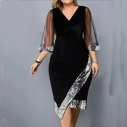 Kleid mit transparenten Mesh-Ärmeln und asymmetrisch platzierten Pailletten