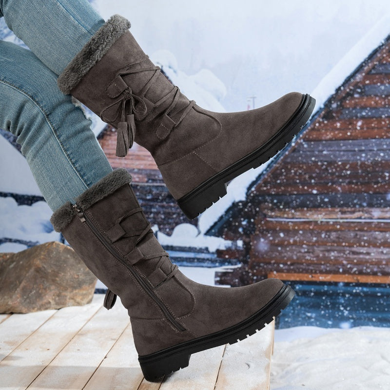 Damen Stiefel aus Kunstwildleder in Wadenhöhe mit Quasten