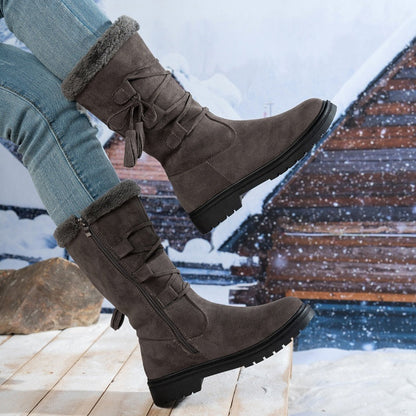 Damen Stiefel aus Kunstwildleder in Wadenhöhe mit Quasten