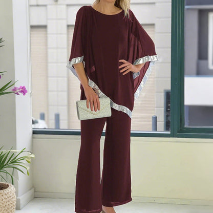 Set aus elegantem Poncho-Oberteil mit Paillettenbesatz und weit geschnittener Hose